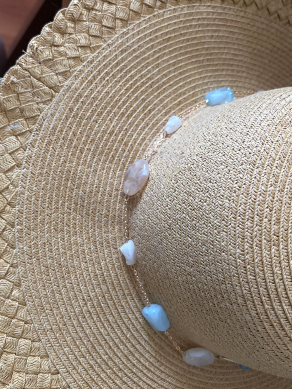 Two New wide-brimmed sun hat. One with natural stones and the other with cheetah